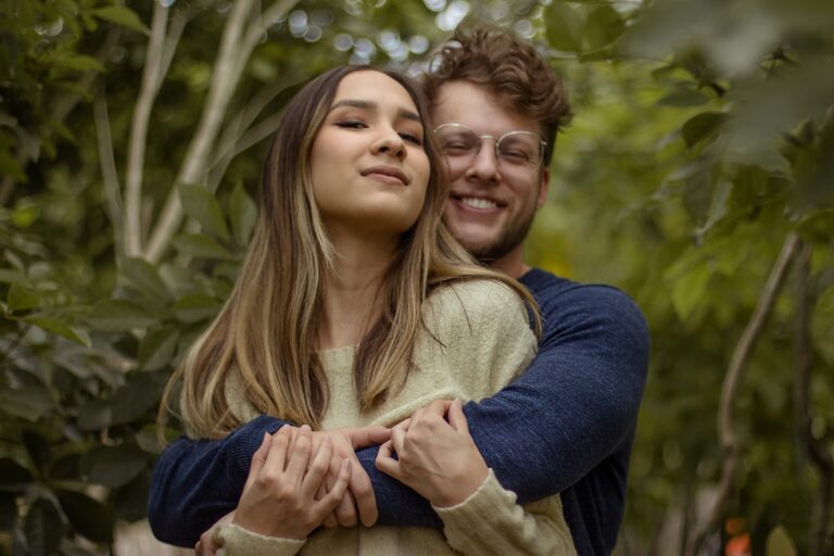 happy couple in an orlando botanical garden posing for a photoshoot