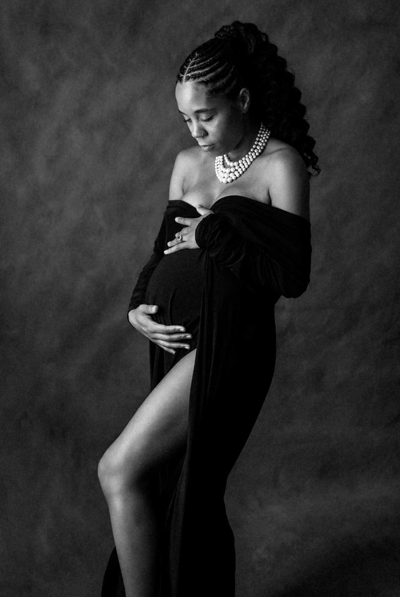 elegant pregnant woman posing in a Vogue magazine style