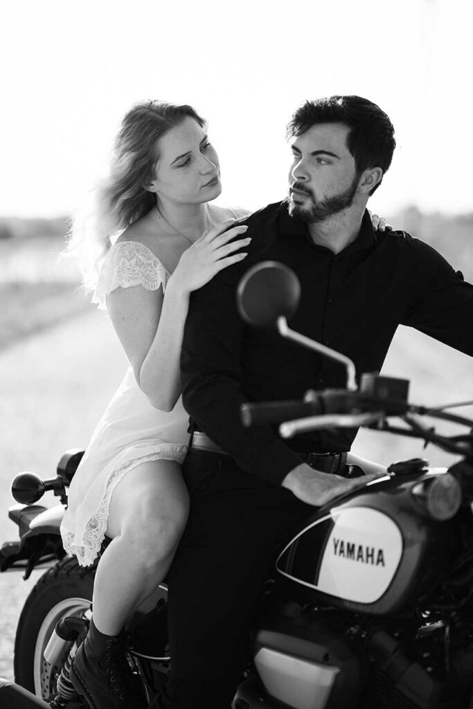 engagement couple on motorcycle black and white photo